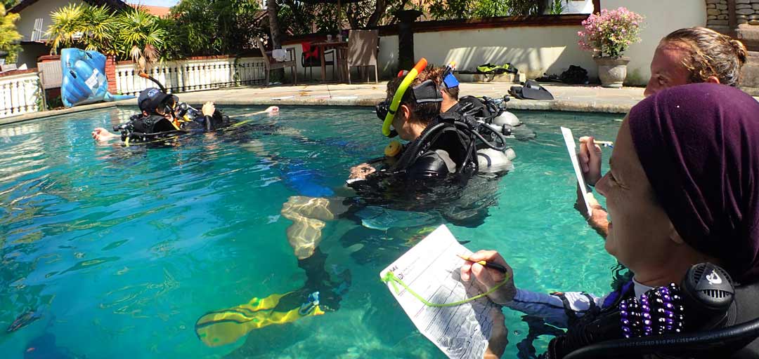 PADI scuba diving Instructor-and Padi Divemaster is working at the pool